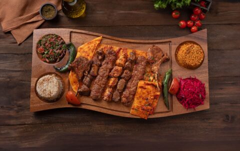 A vertical spit of juicy, charcoal-grilled döner meat