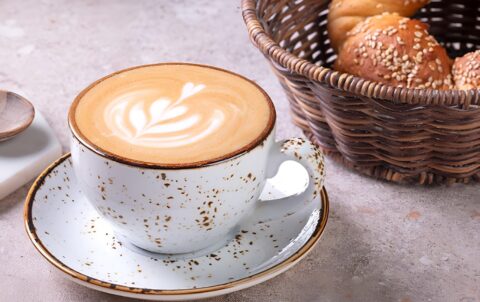 Cup of Turkish tea with sesame simit bread